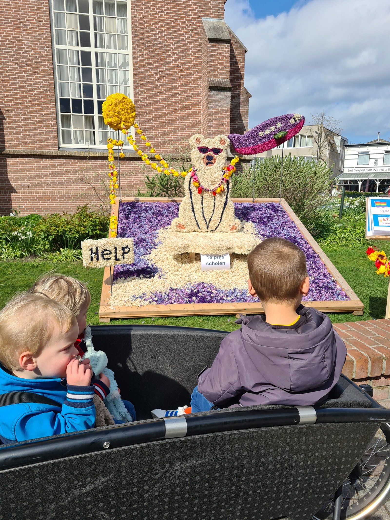 The small village square that turns into a flower art gallery