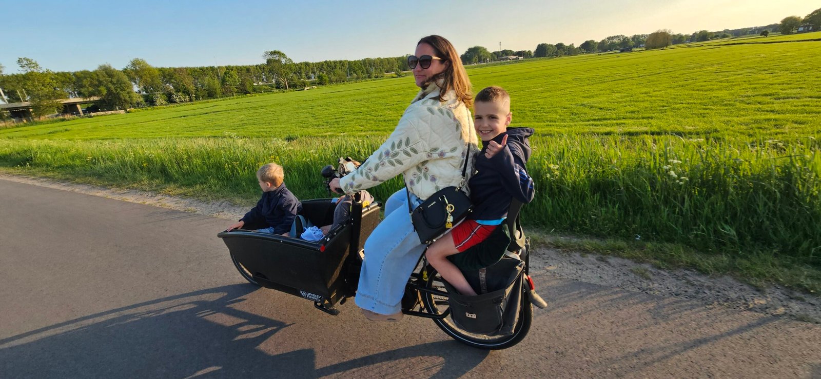Kids cycling through the meadows along the ringvaart canal Lisse 2026
